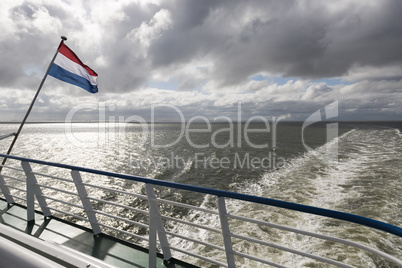 Wadden Sea with Dutch flag.