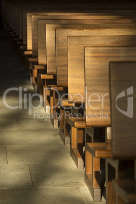Pews in the morning light.