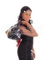 Closeup of African American woman with purse.