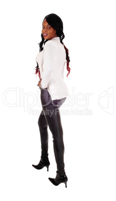 Lovely African American woman in leather pants.