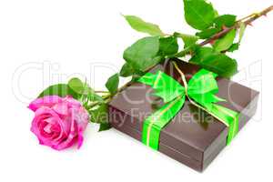 Present and rose isolated on white background