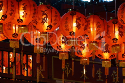 Chinese paper lantern in front of a wall