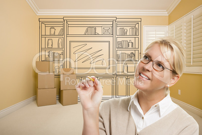 Female Holding Pencil In Room With Drawing of Entertainment Unit