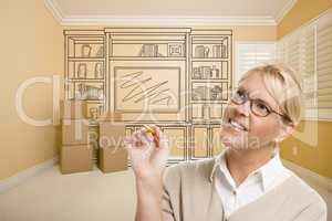 Female Holding Pencil In Room With Drawing of Entertainment Unit