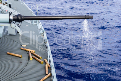 a fired cannon from a warship in sea