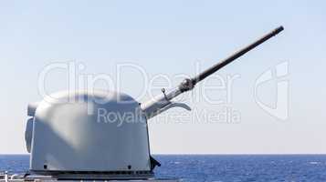 cannon of a warship aims to a target