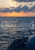 german navy cannon on sunset in the sea