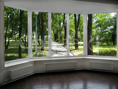 window with view of summer city park
