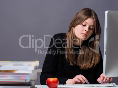 Young beautiful woman working on a computer