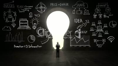 businessman Standing in front of black, shape of bulb light, Business plan and various graph in black wall concept.