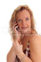 Happy blond woman on cell phone.