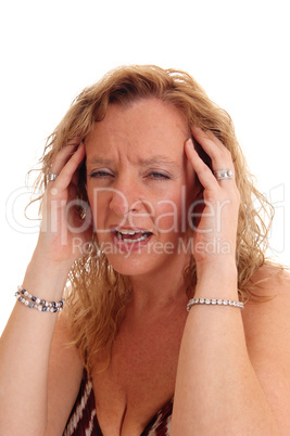 Closeup of woman with headache.