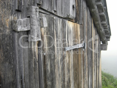 Door of wooden hut in the mountains