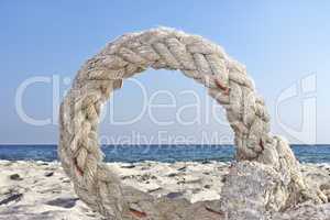 Ring of old rope on a seashore