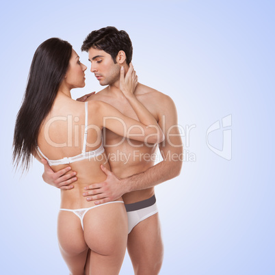 sexy couple on plain background