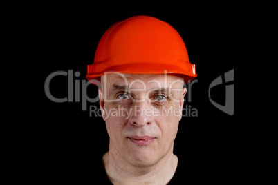 Construction worker in hard hat on gray background