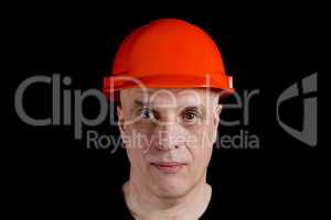 Construction worker in hard hat on gray background