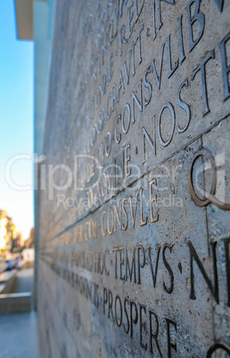 Latin inscription on wall in Rome, Italy