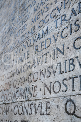 Latin inscription on wall in Rome, Italy