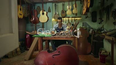 9-Portrait Young Man Lute Maker Smiling At Camera In Shop