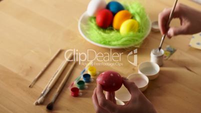 Female Hand Painted Easter Eggs with a Brush
