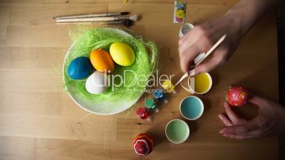 Female Hand Painted Easter Eggs with a Brush