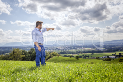 man outdoors pointing