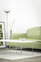 green sofa in a white room