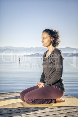 yoga woman sitting lake