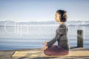 yoga woman sitting lake