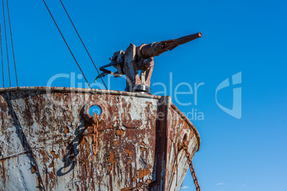 Close-up of harpoon gun on rusty whaler