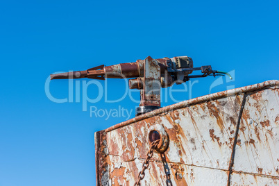 Close-up of rusty harpoon gun in bows