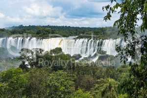 Tourists on observation deck watching Iguazu Falls