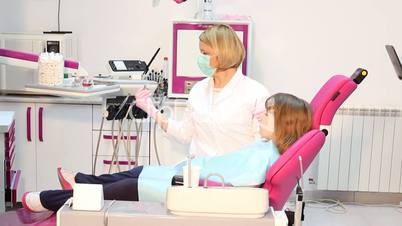 female dentist and little girl patient