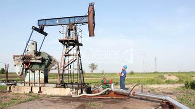 oil worker check pump jack