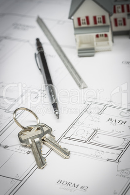 Home, Pencil, Ruler and Keys Resting On House Plans