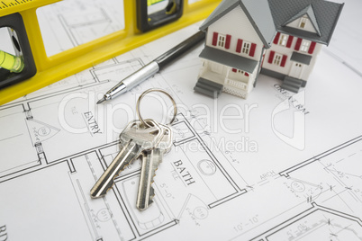 Home, Construction Level, Pencil and Keys Resting on House Plans