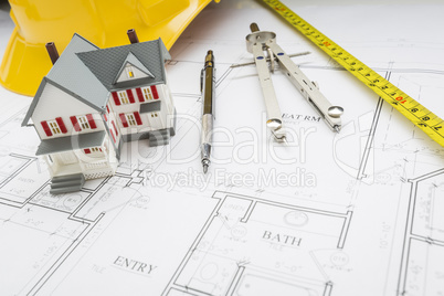 Home, Measuring Tape, Hard Hat, Pencil, Compass on House Plans