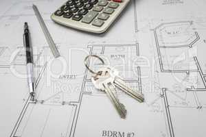 Pencil, Ruler, Calculator and Keys Resting on House Plans