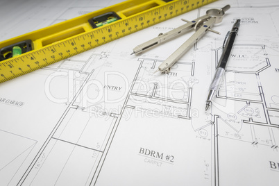 Construction Level, Pencil, Ruler and Compass Resting on House P