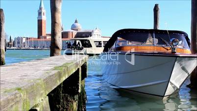Small boat bobbing in Venice lagoon