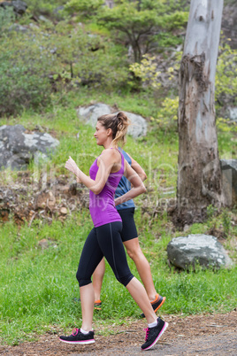 Fit couple jogging on field