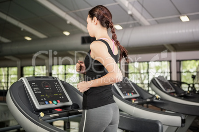 Woman jogging on treadmill