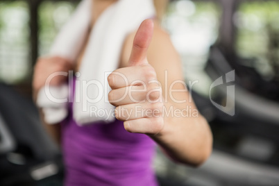 Woman showing her thumbs