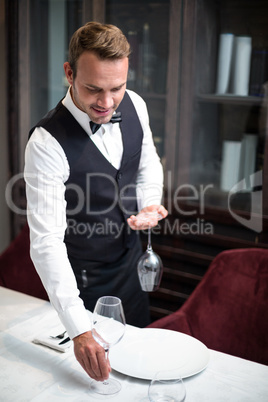 Waiter setting the table