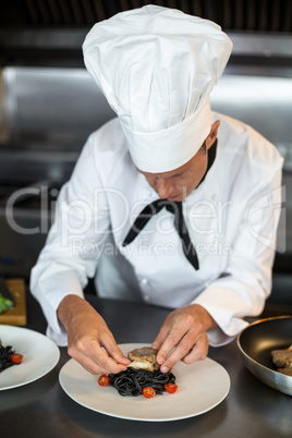 Chef preparing food in kitchen