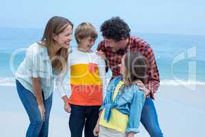 Parents enjoying with children at beach