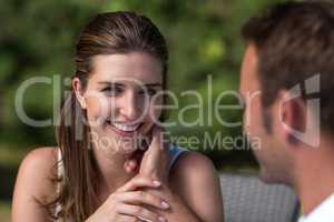 Portrait of smiling wife with husband in park