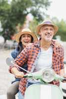 Happy couple on moped