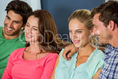 Group of happy friends sitting together